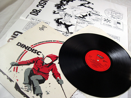 Record and label, front cover, game sheet in background