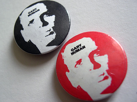 Gary Numan button badge design variants - black/black and red/black