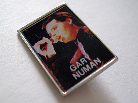 Gary Numan metal lapel badge with 1979 'Touring Principle' era live shot